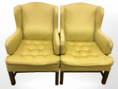 A pair of mid 20th century continental wing back armchairs in olive button fabric,