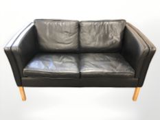 A late 20th century Danish black leather two seater settee,