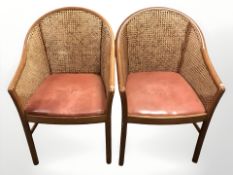 A pair of wooden frame bergere armchairs