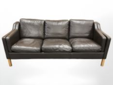 A late 20th century Danish brown stitched leather three seater settee,
