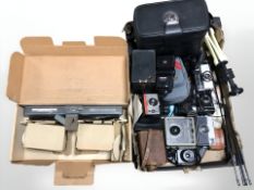 A group of vintage and modern cameras, including Kodak, Brownie,