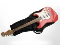 A Squier by Fender Strat electric guitar with soft carry bag.