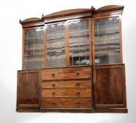 An impressive early Victorian mahogany breakfront secretaire bookcase,
