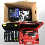 A group of tools and hardware including Hitli, MD2000 sealant gun in case, spanner set,