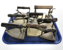 A group of 19th century brass irons.