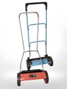 An Einhell push-along garden mower, plus another.