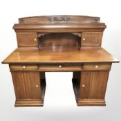 An early 20th century continental mahogany twin pedestal desk,