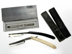 Two antique cut throat razors, one marked Christel, Solingen,