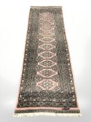 A Lahore Bokhara runner, Pakistan, signed to one end,