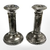 A pair of silver column candlesticks, height 10 cm.