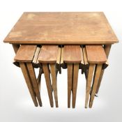 A teak nest of five tables,