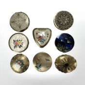 A group of eight compacts,