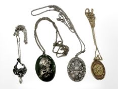 A silver pendant on chain, a similar silver-gilt example, anther silver pendant,