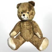A vintage jointed teddy bear with growler,