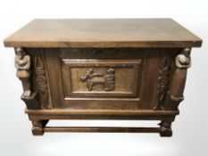 A 20th century continental carved oak cabinet,