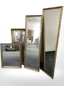 Four various reproduction gilt mirrors, largest 120 cm x 41 cm.