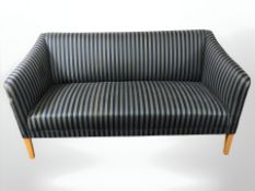 A 20th century continental salon settee in striped upholstery, 150 cm x 77 cm x 75 cm.