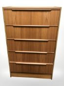 A 20th century Danish teak and MDF five drawer chest,