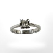 An 18ct white gold princess cut solitaire diamond ring, size M CONDITION REPORT: 2.