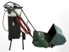 A Qualcast electric lawn mower and a Macallister garden shredder.