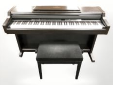 A Yamaha Clavinoha CLP-840 keyboard with lead and stool,
