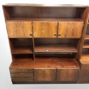 A 20th century Danish open bookcase, fitted cupboards and drawers, 150 cm x 40 cm x 176 cm.
