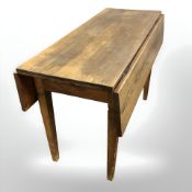 A 19th century pine dropleaf table, length 99 cm.