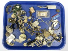 A group of costume jewellery, old bus tickets, key with lock, bangles etc.
