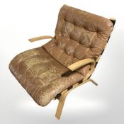 A 20th century Danish bentwood tan leather armchair (as found) CONDITION REPORT: