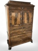 A 19th century Biedermeier-style flame mahogany secretaire cabinet,
