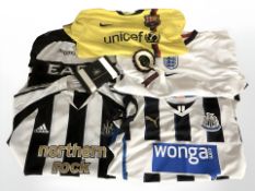 A Barcelona Lionel Messi football shirt, size XL, Newcastle United shirt, size L, another size M,