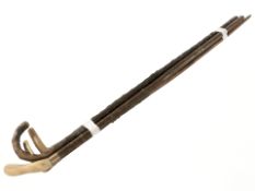 Three 19th century horn handled walking sticks and another with silver collar.