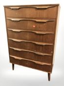 A 20th century Danish teak and pine six drawer chest,
