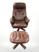 A Scandinavian bentwood Burgundy leather swivel armchair and matching footstool.