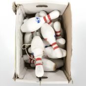 A quantity of bowling pins, one converted into a tablelamp.