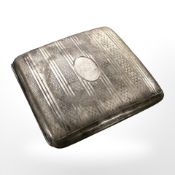 A silver cigarette box with engine turned decoration, marks rubbed.