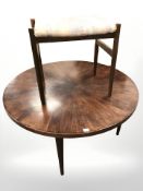 A 20th century Danish teak circular coffee table, diameter 110 cm, together with a stool.