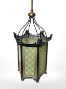 A 20th century painted metal hexagonal hall lantern, with two-tone glass panels, height 96 cm,