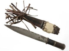 An African knife in leatherwork sheath.