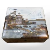 A lacquered Japanese box containing costume jewellery