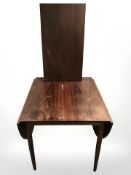 A 20th century Danish rosewood effect drop leaf extending dining table, with two leaves,