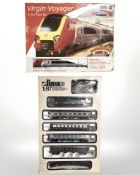 A Bachmann Branch Line Virgin Voyager three car train set and a Lima HO 1:87 electric train set,