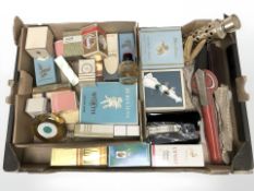 A group of perfumes and fragrances (opened), together with two dress rings,