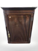A George III style mahogany and satin wood banded corner cabinet,