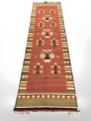 A flatweave kilim runner, 323 cm x 93 cm.