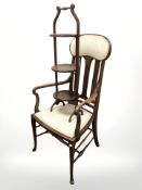An Edwardian inlaid mahogany armchair and a three tier cake stand