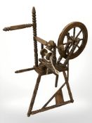 An oak bobbin turned spinning wheel