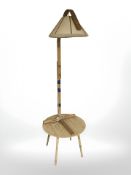 A Scandinavian circular coffee table and a bentwood standard lamp