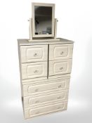 A contemporary MDF three drawer chest, 81 cm, further pair of bedside chests and a mirror.