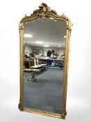 A 20th century gilt gesso bevelled full length mirror in the Victorian style,